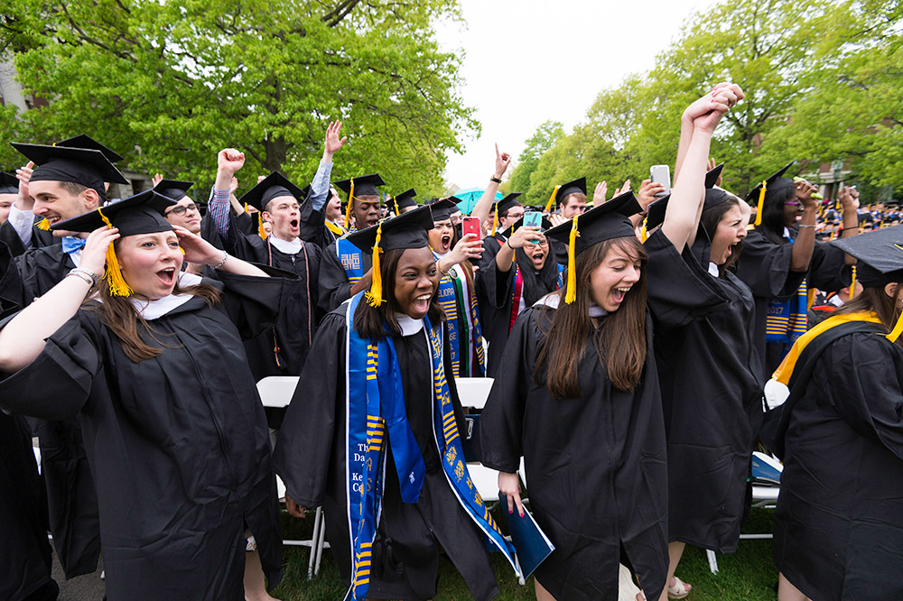 large crowd of students celebrate during commecement