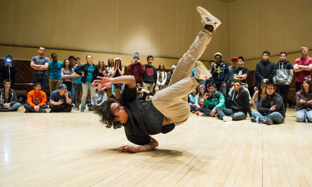 Feature image man breakdancing in front of a crowd