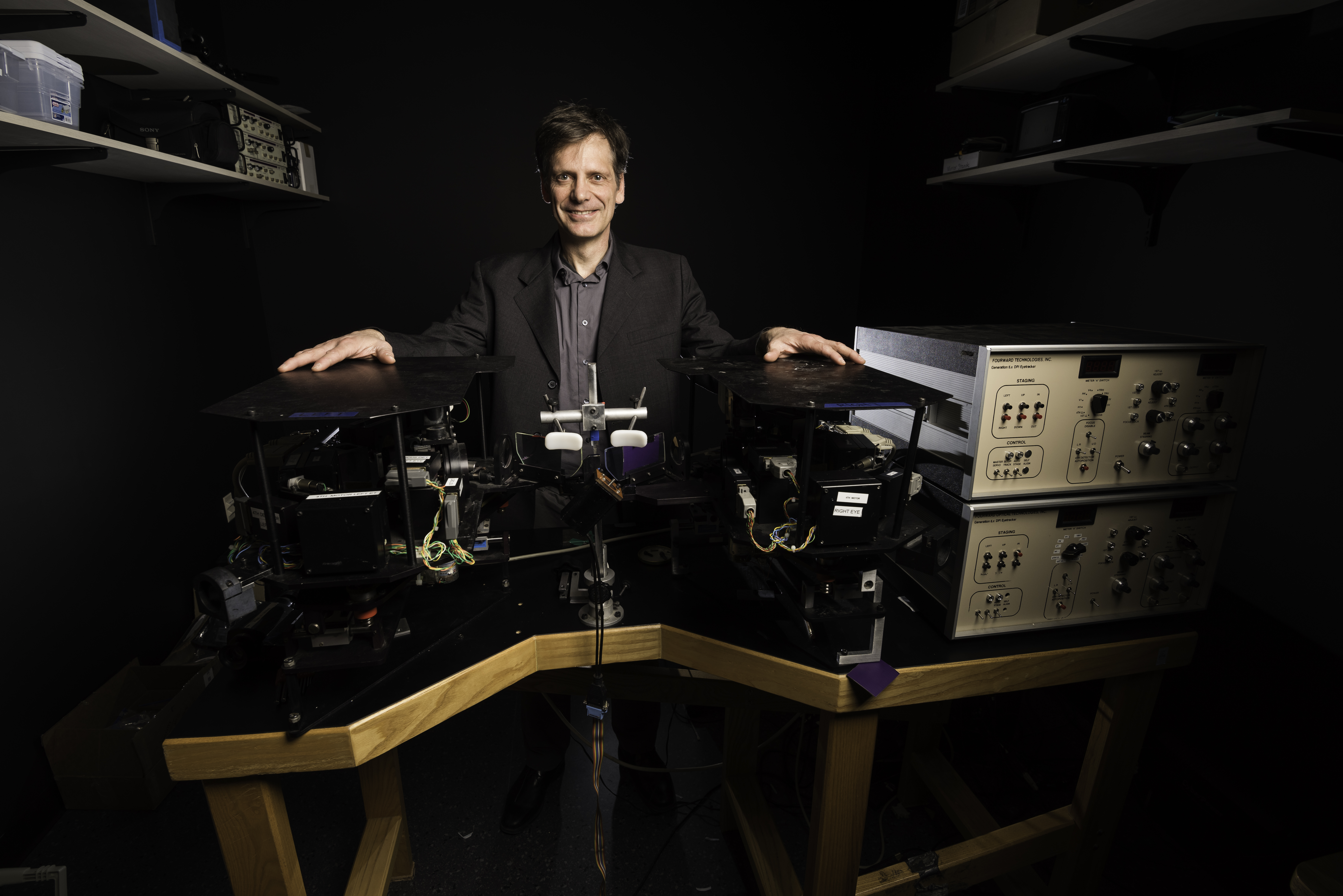 professor Michele Rucci with equipment in his lab