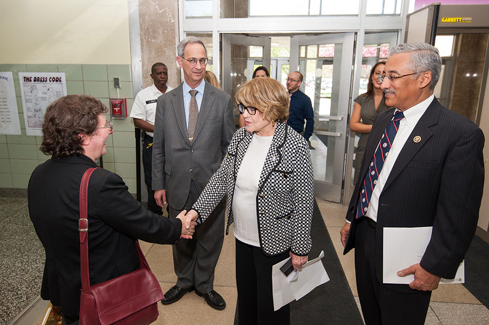 Louise Slaughter shaking hands in a crowd