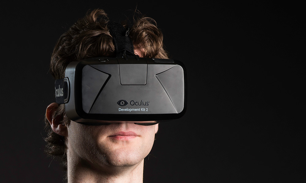 Feature image photo of student wearing a AR/VR headset
