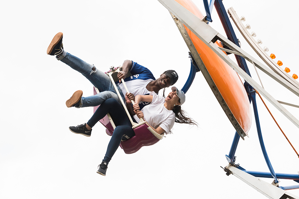 Feature image two students riding a carnival ride