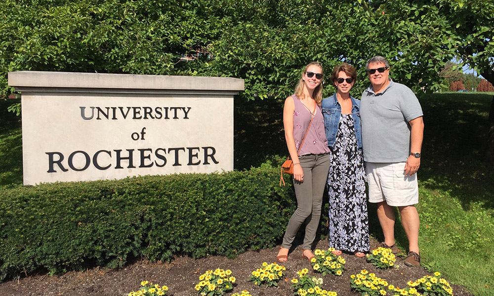 Feature image a family next to a University of Rochester sign