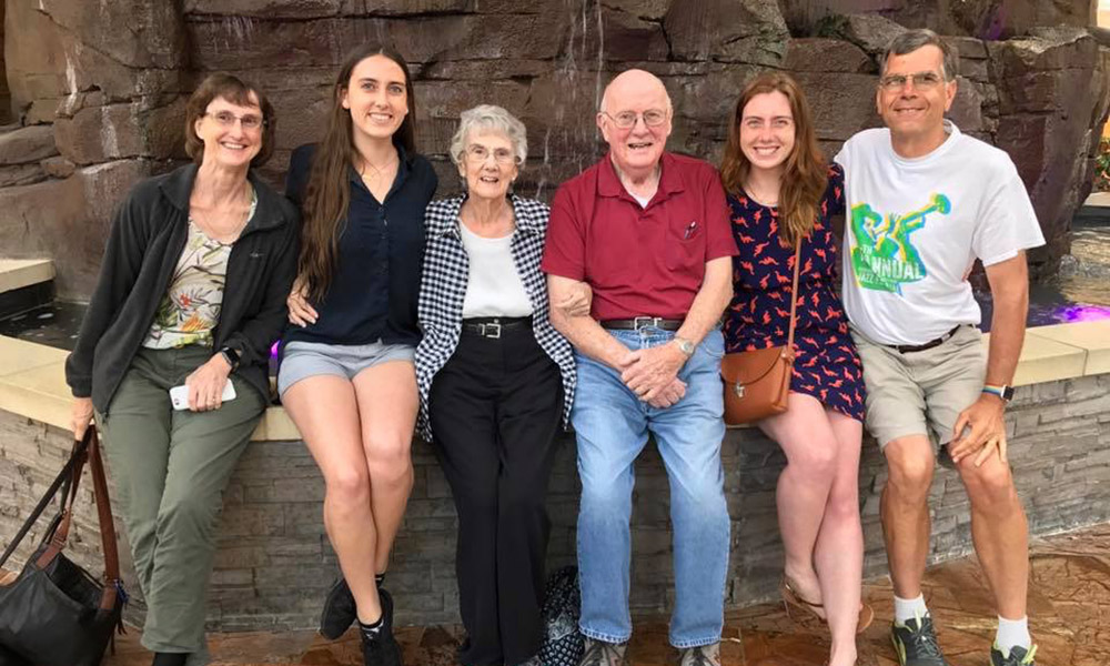 photo of a student with her parents and grandparents