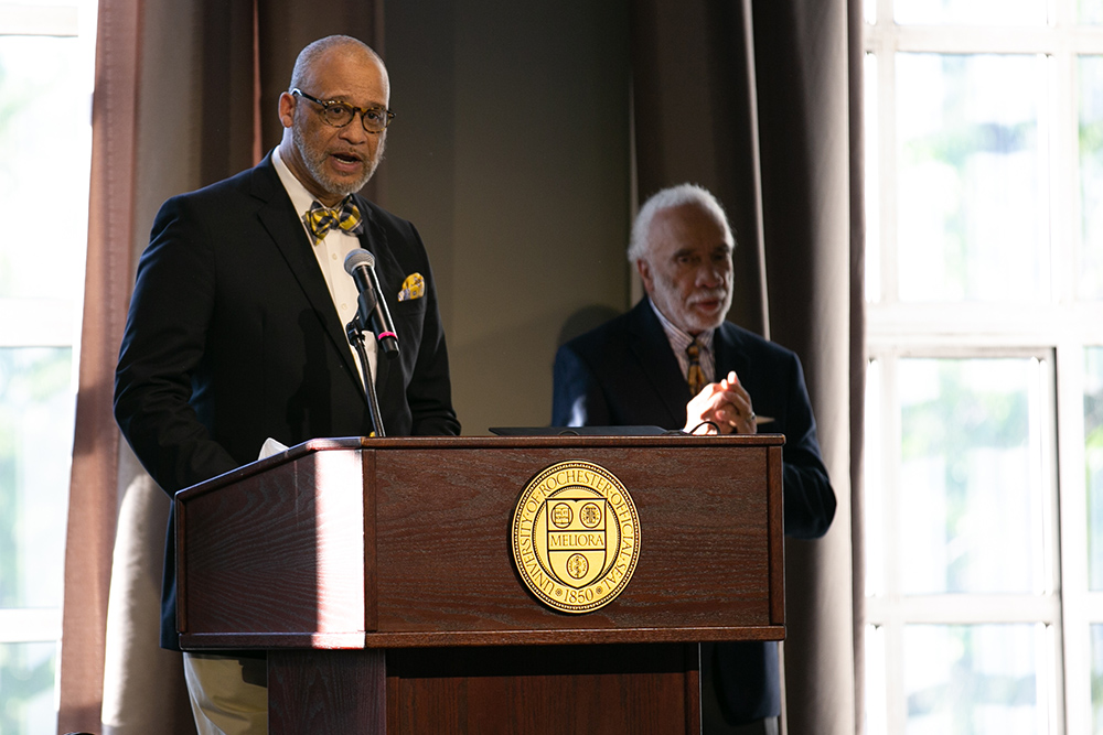 two people behind the podium