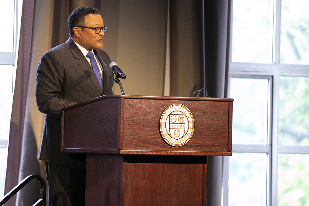 Kenneth Morrid Jr. standing behind a podium