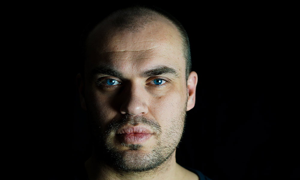 man staring intently into the camera