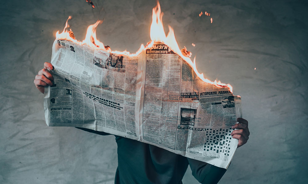 Feature image newspaper on fire