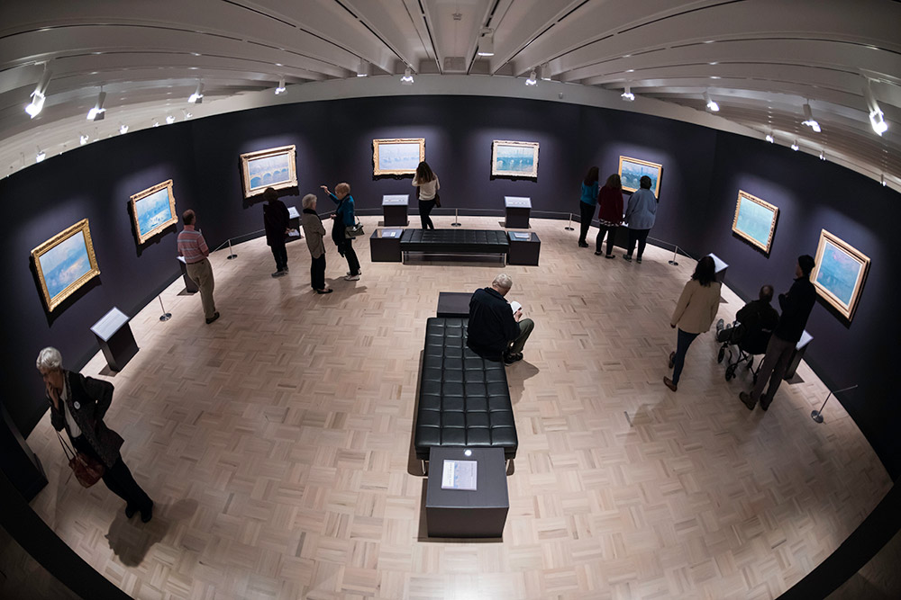 Museum patrons view Monet painting at Memorial Art Gallery