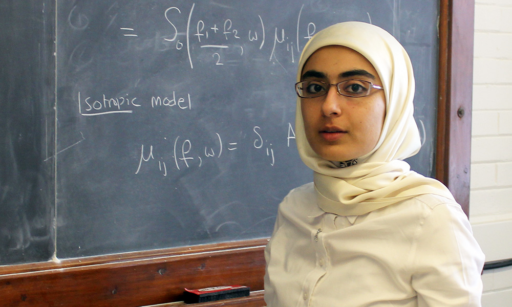 Feature image Asma Al-Qasimi in front of blackboard covered in scientific formula