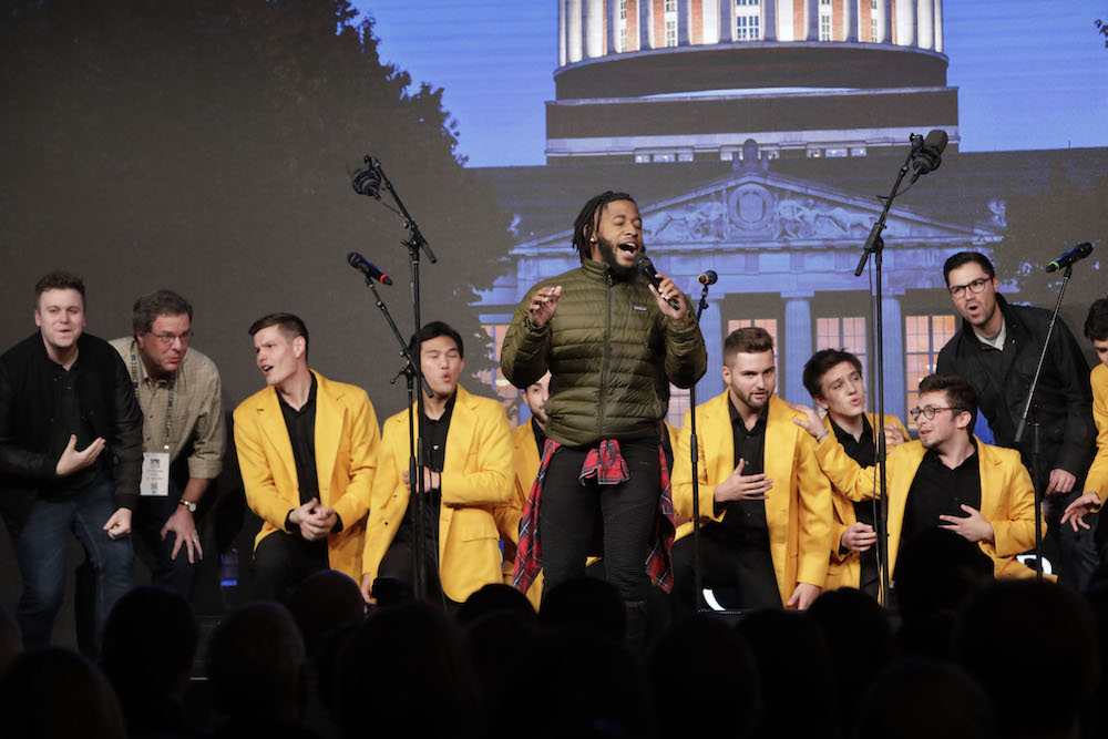 group of singers perform on stage