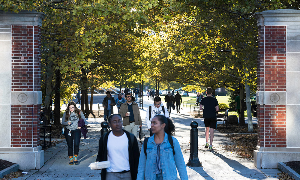 Feature image students walking around campus on a sunny fall day