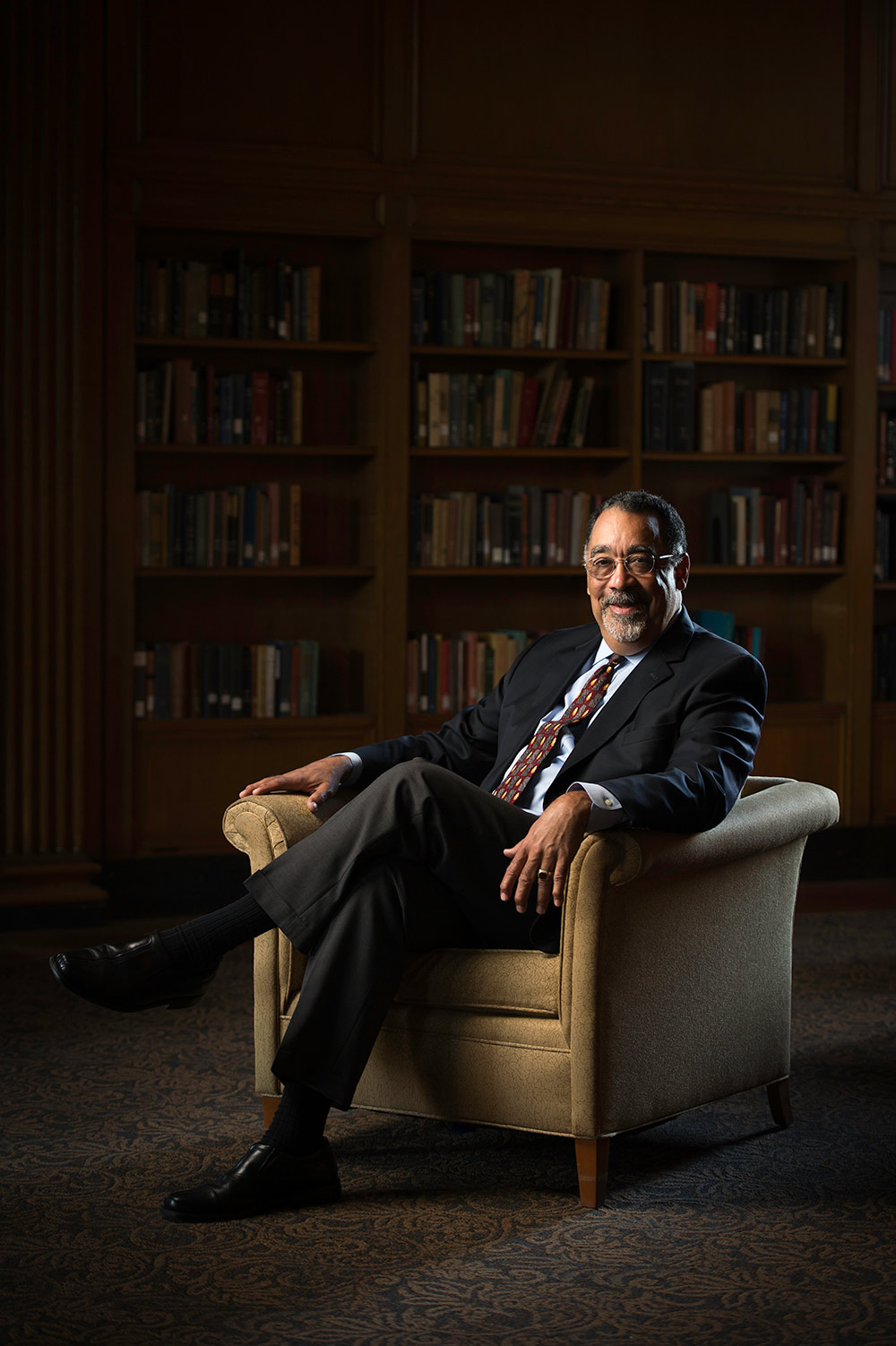 portrait of Paul Burgett sitting in an armchair