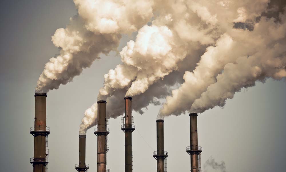 Feature image Six smokestacks release exhaust into the air, which contributes to rising ozone levels.