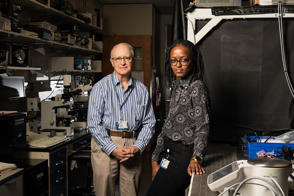 two researchers pose for a photo in the lab