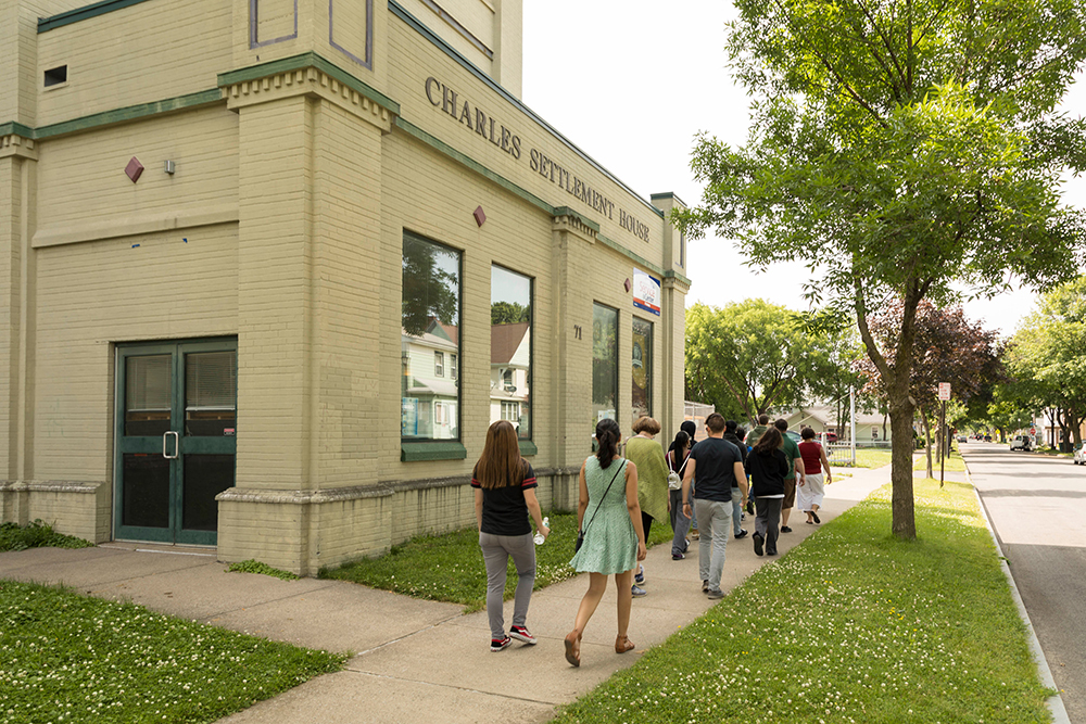 group of students walking outside East High School building. 