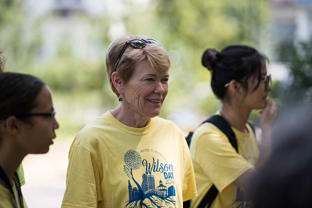 Sarah C. Mangelsdorf listens, along with students.