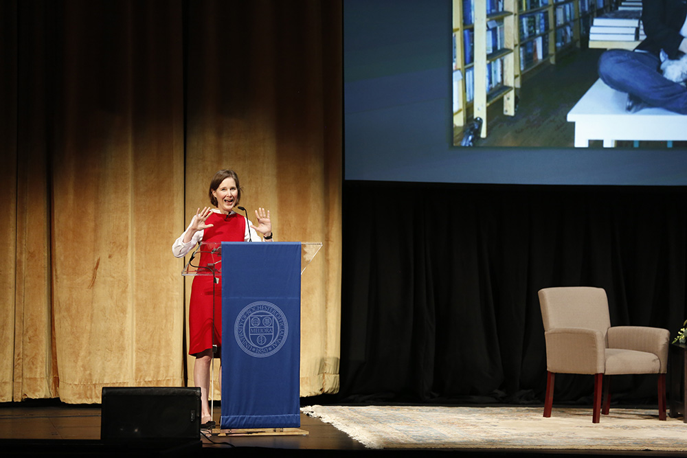 ann patchett stands at podium