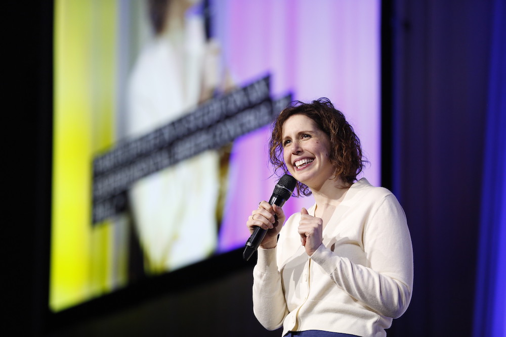 Vanessa Bayer holding microphone