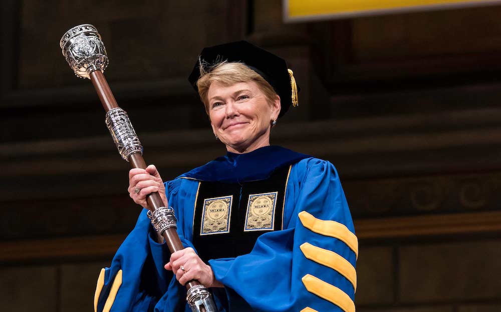 Sarah Mangelsdorf holding the university mace