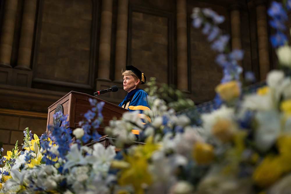 Sarah Mangelsdorf speaking at podium.