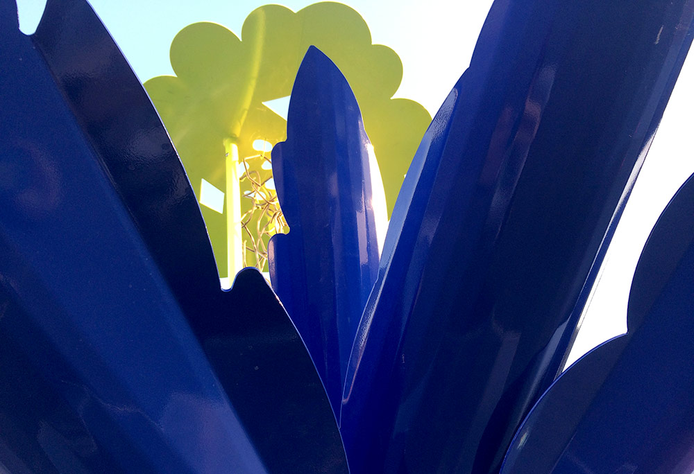 close-up detail of a sculpture made with blue and yellow materials.
