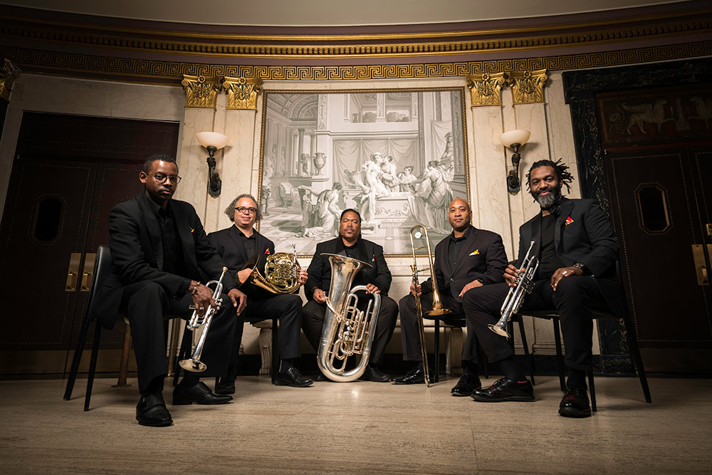 portrait of five musicians with their instruments.