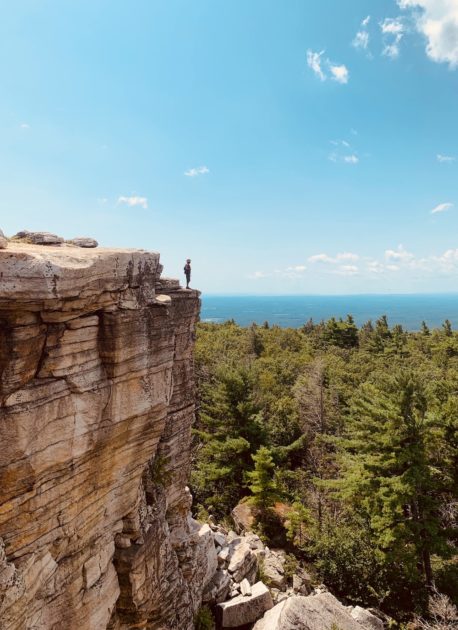 person standing on the edge of a cliff