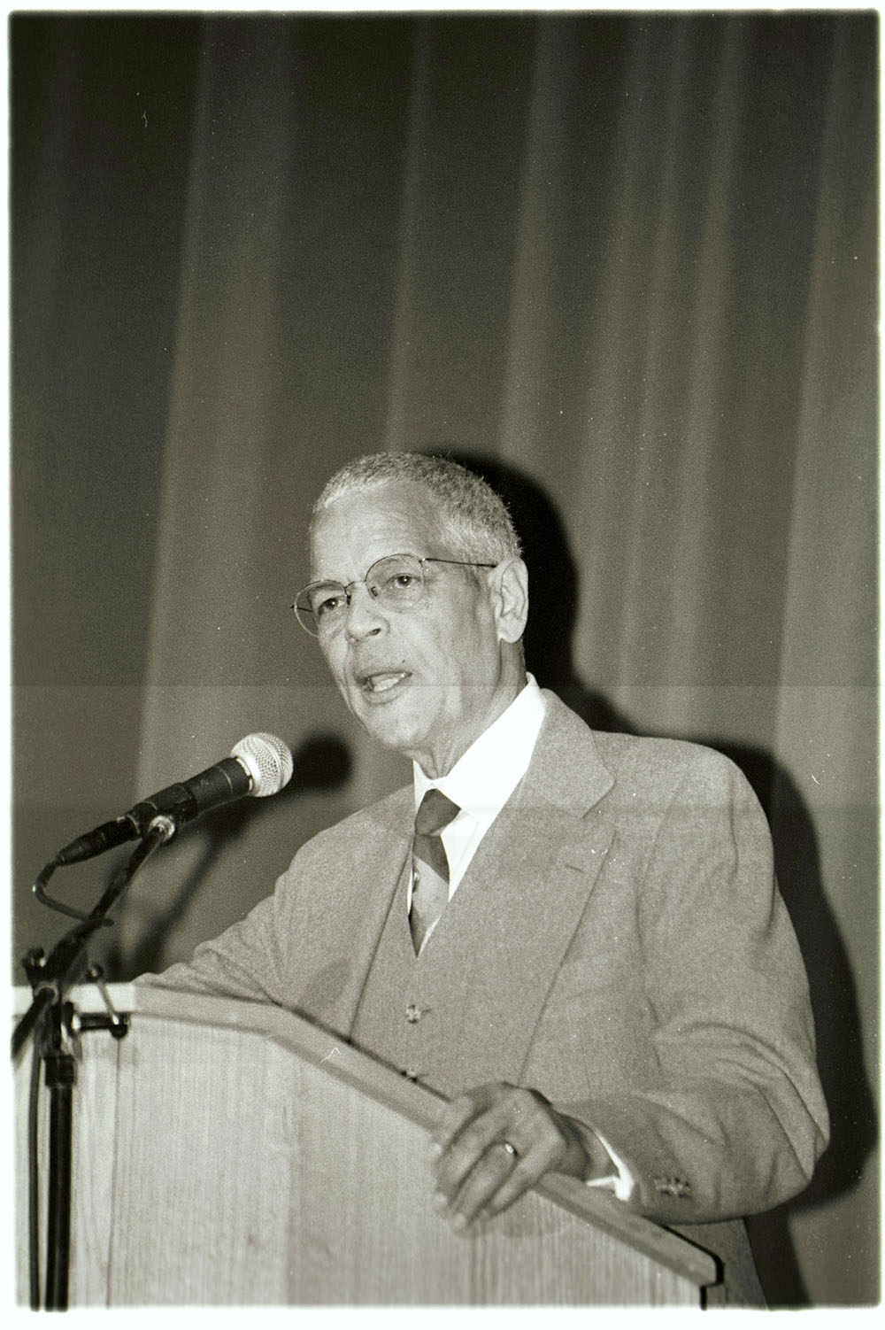 Black and white archival image of Julian Bond at a podium during the inaugural Martin Luther King Jr. Commemorative Address in 2001 at URochester.