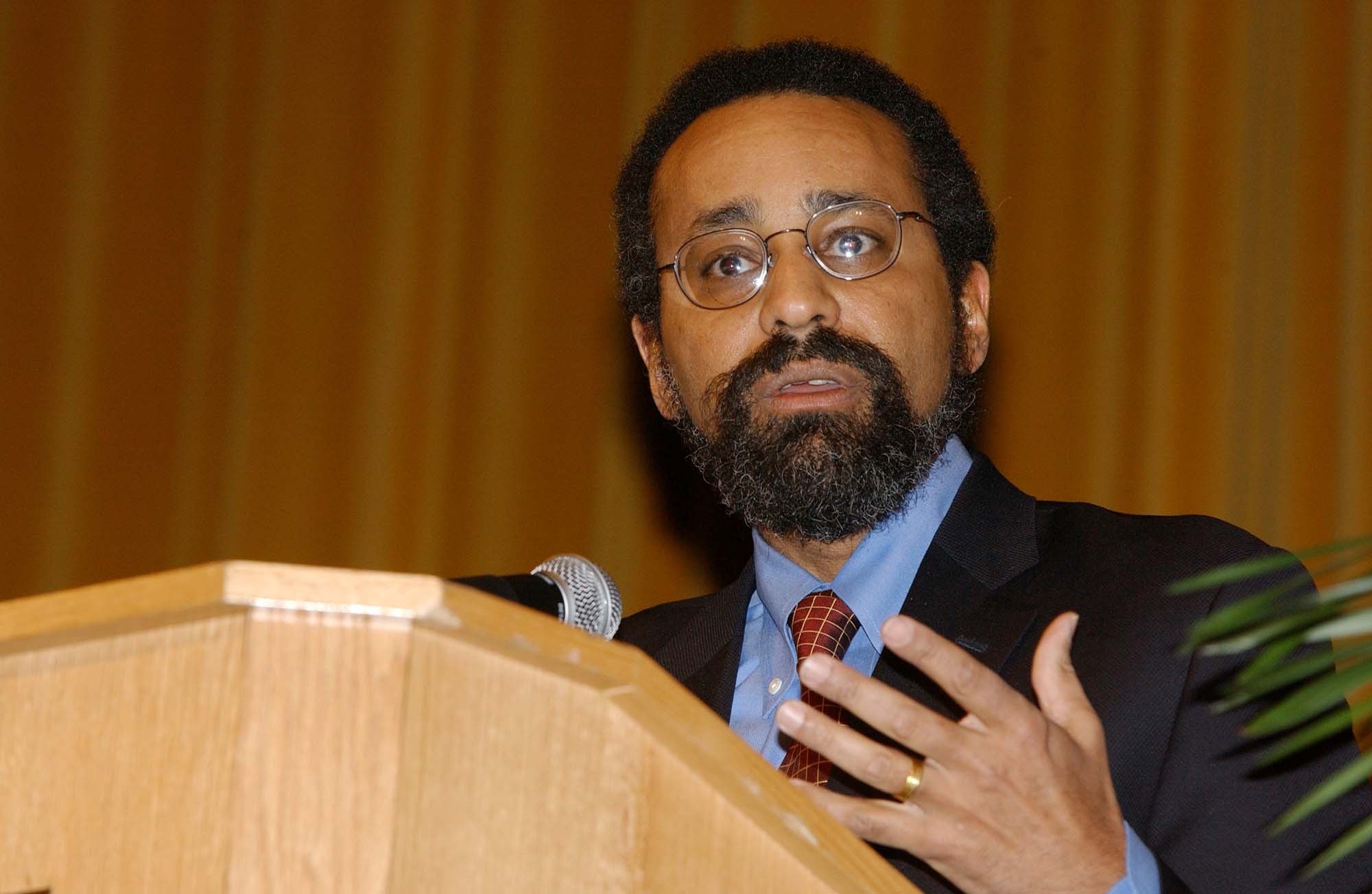 Christopher Edley Jr. speaks at a podium during the 2004 Martin Luther King Jr. Commemorative Address at URochester.