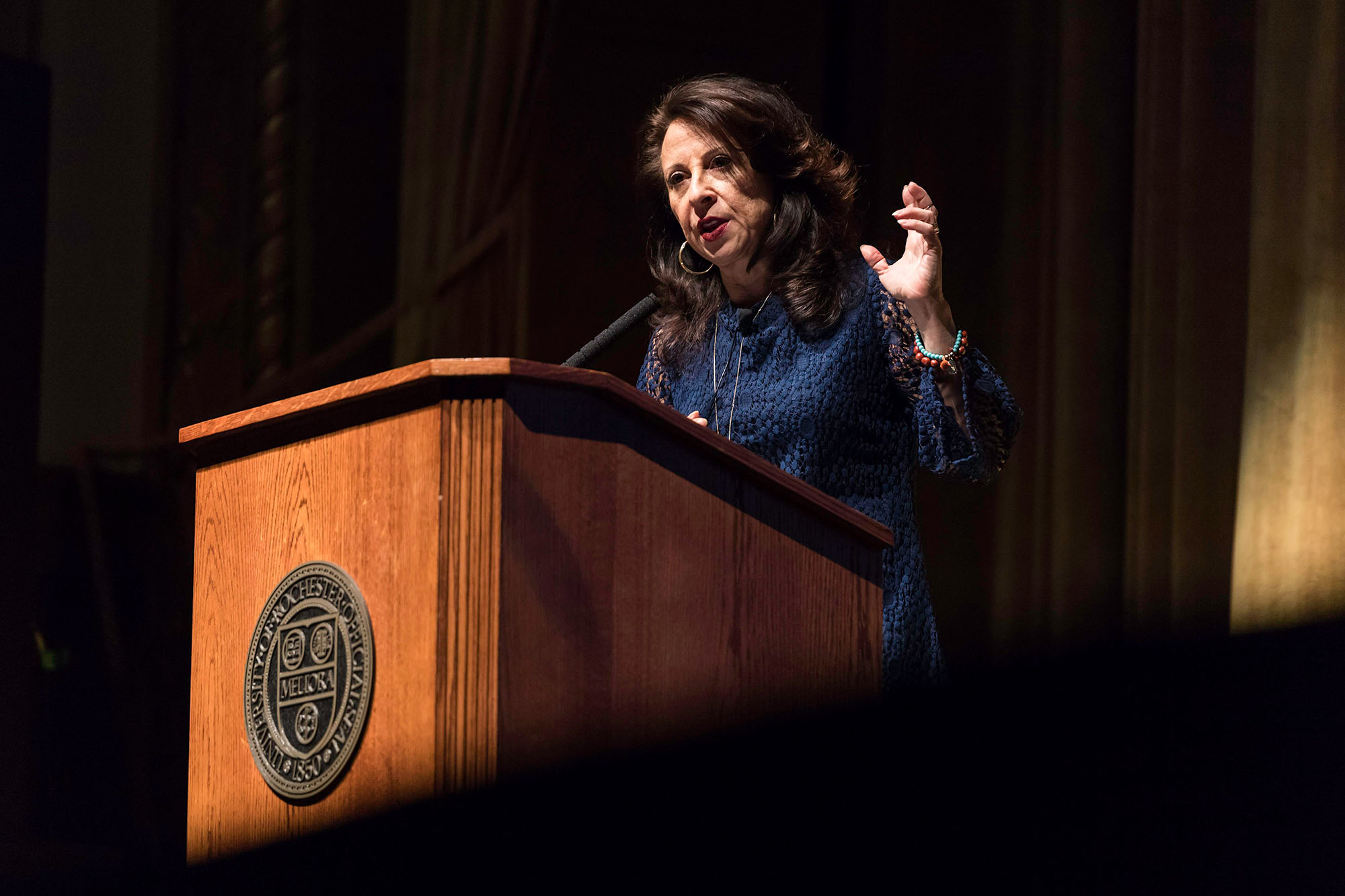 Maria Hinojosa speaking at a podium during the 2018 Martin Luther King Jr. Commemorative Address at URochester.