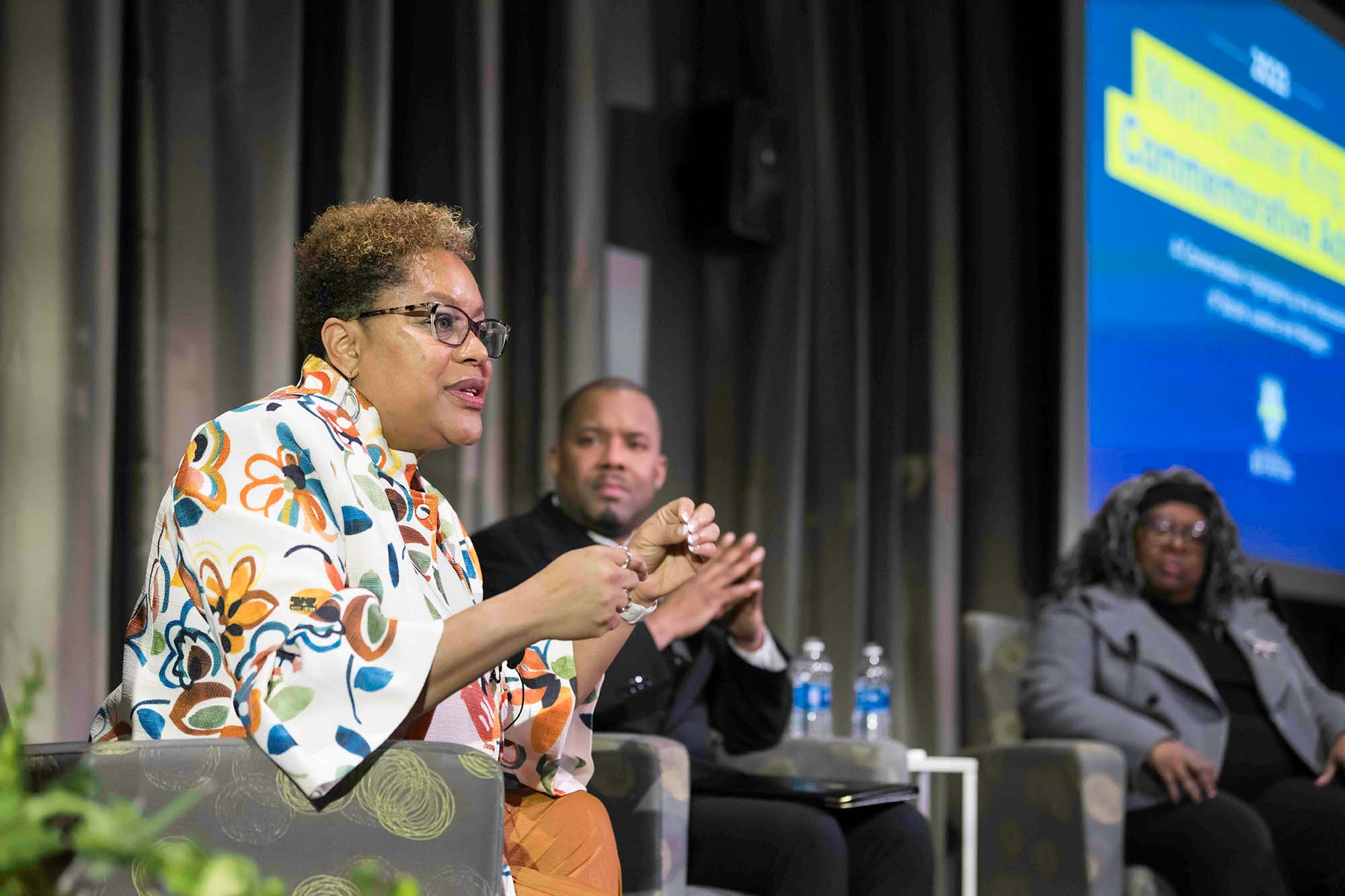 Valeria Sinclair-Chapman, Jeffrey McCune Jr., and Anthea Butler seated on stage during the 2023 Martin Luther King Jr. Commemorative Address at URochester.