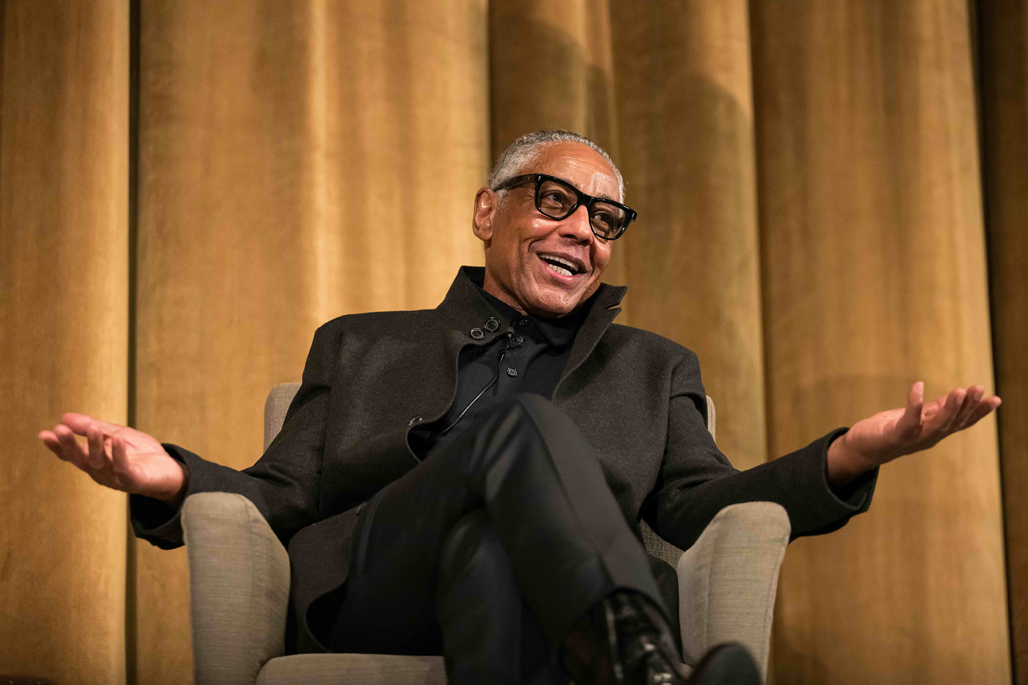 Giancarlo Esposito sitting and speaking at the 2025 Martin Luther King Jr. Commemorative Address at URochester.