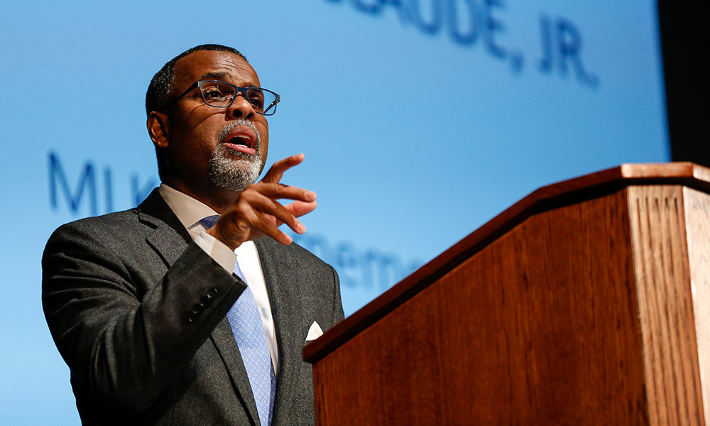 Feature image Eddie Glaude Jr. speaking on stage.