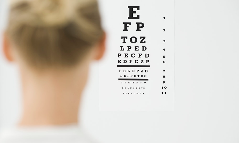 image of person taking eye-chart exam