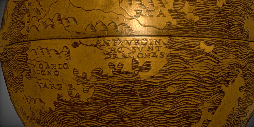 A close-up of the globe shows the Latin text that translates to "Here be dragons" at the equator.