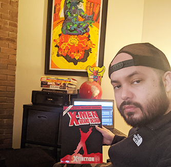 student holds up a comic book.