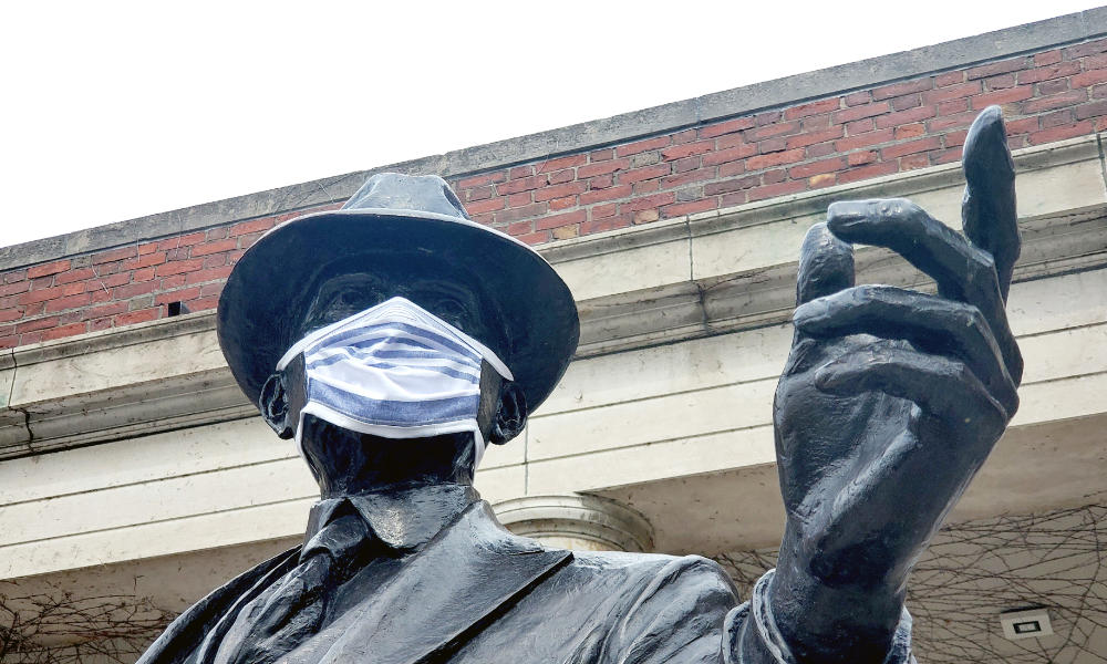 Feature image George Eastman statue on River Campus shows Eastman wearing a properly fitted homemade face mask.