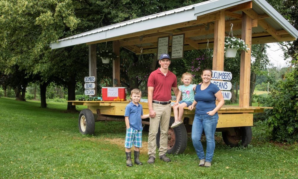 Feature image Bolonek family pictured on their farm in Mumford, New York.