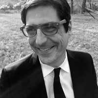 black and white headshot of Heuer in suit