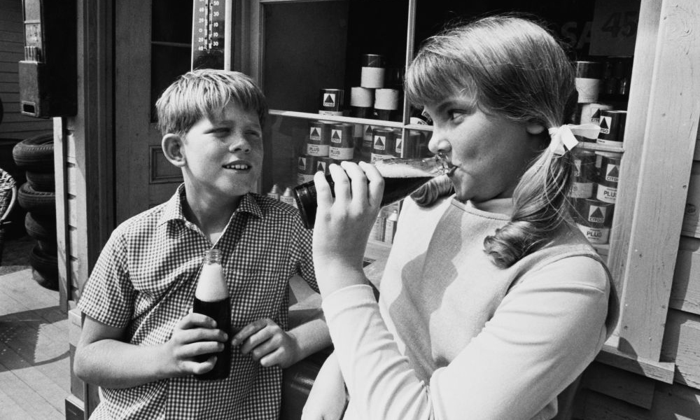 In black and white, scene from Andy Griffith Show in which Opie courts older girl.