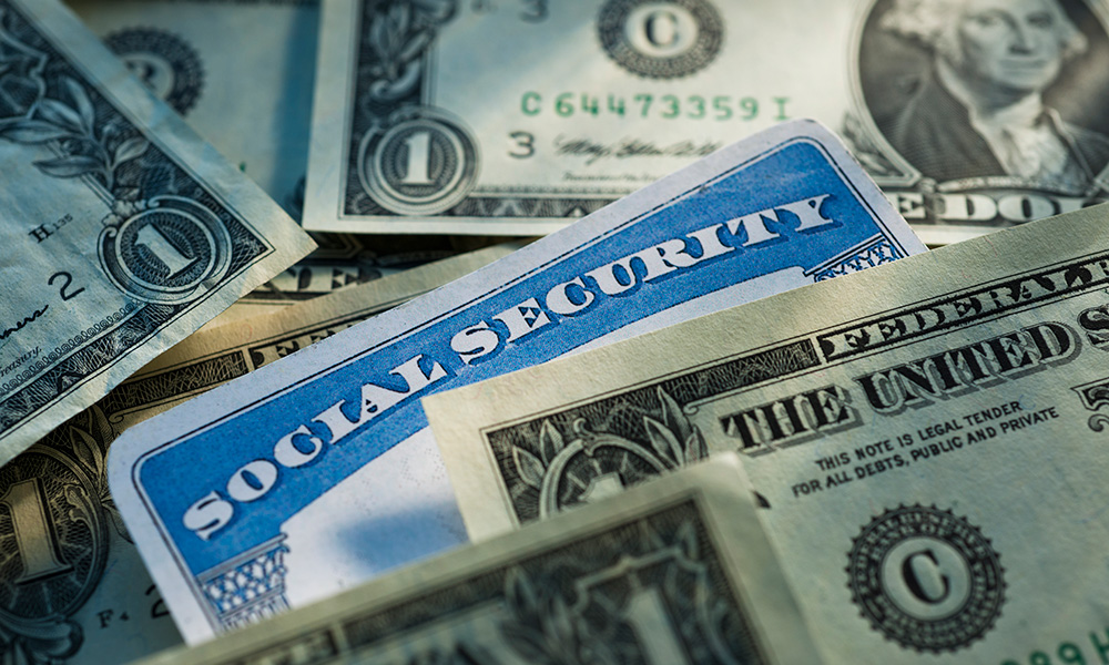 Feature image social security card surrounded by money