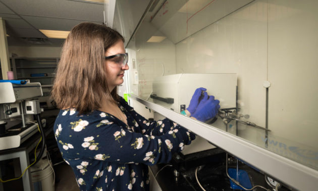 Madeline Vonglis operates lab equipment.