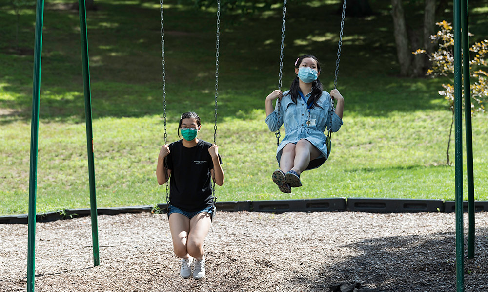 students on swings