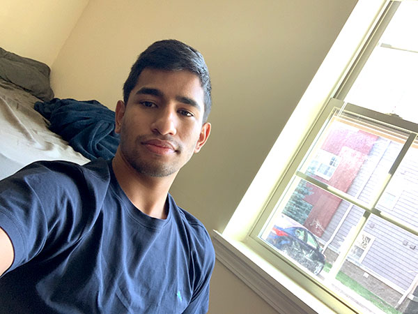 selfie of a student in front of his window