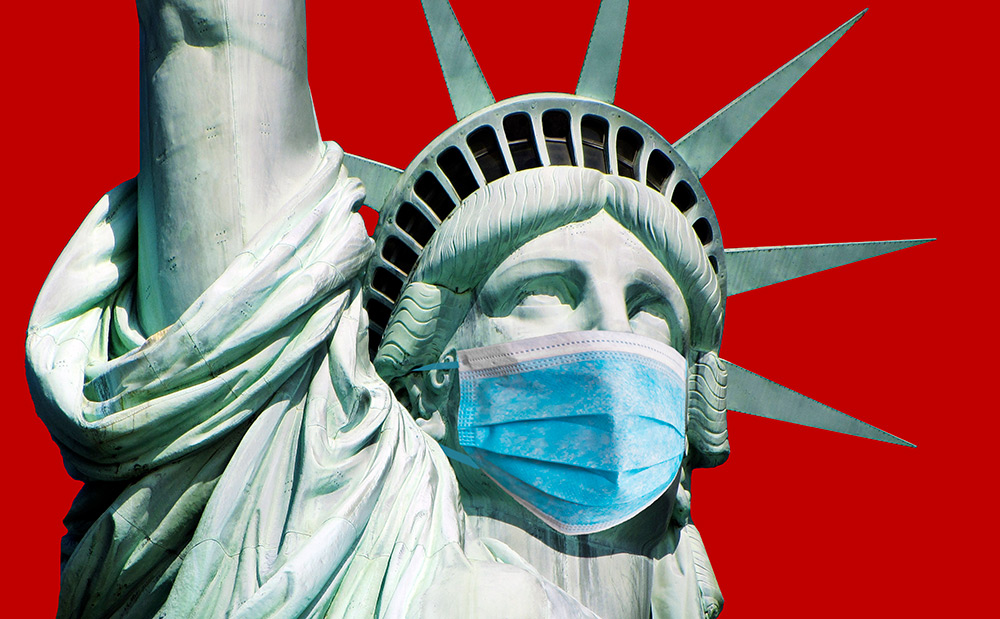 statue of liberty wearing a surgical mask