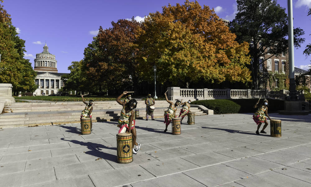 Drummers and dancers perform West African initiation dance on Eastman Quad.