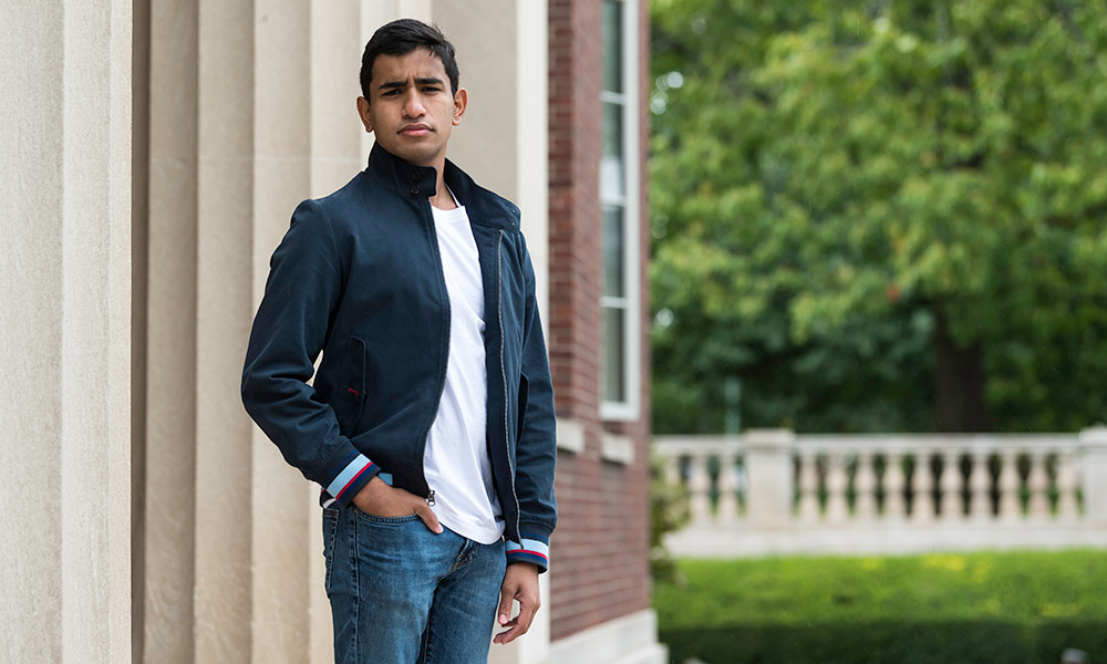 Feature image portrait of Brian Basu standing outside Rush Rhees Library