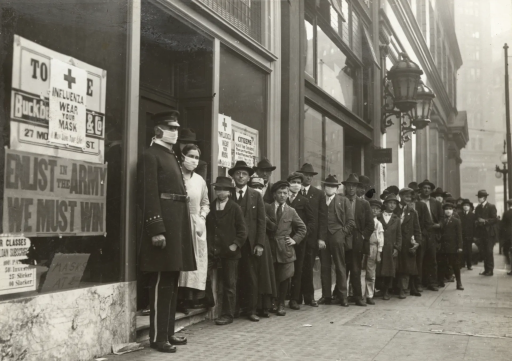 historical photo of people lining up outside a storefront