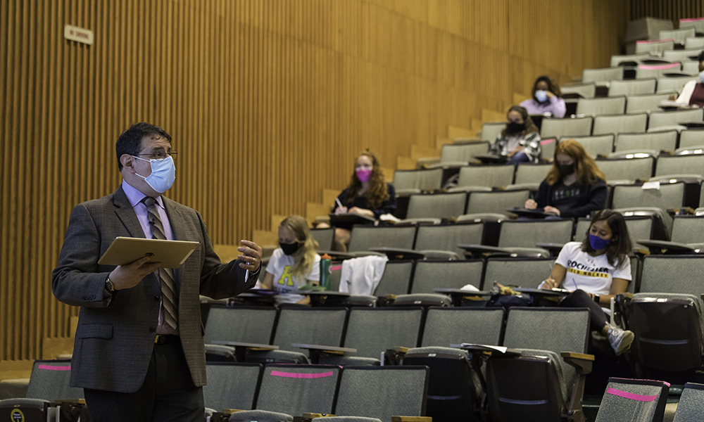 Feature image teacher lecturing in front of a class